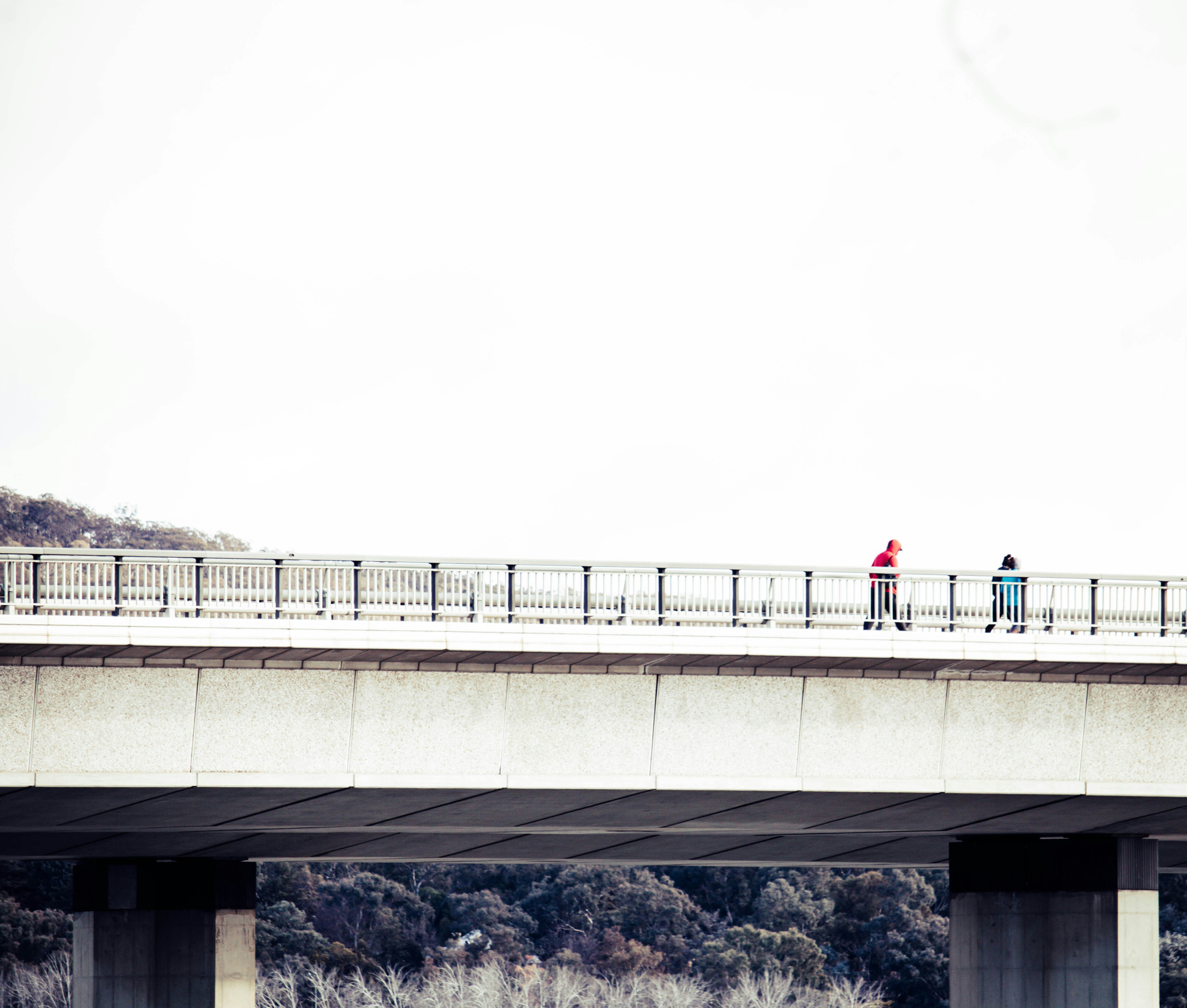 people walking on bridge during daytime